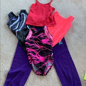 A tank top three leotards and a pair of sweats